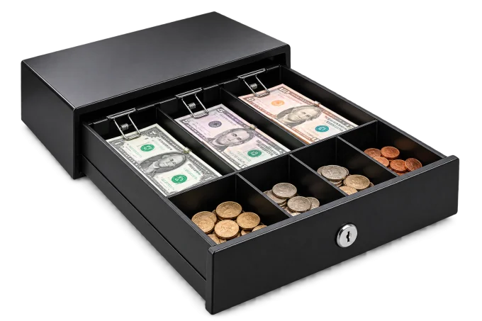 Cajón de dinero abierto con billetes y monedas ordenados
